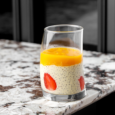 Chia pudding with coconut milk, mango purée, passion fruit and pineapple